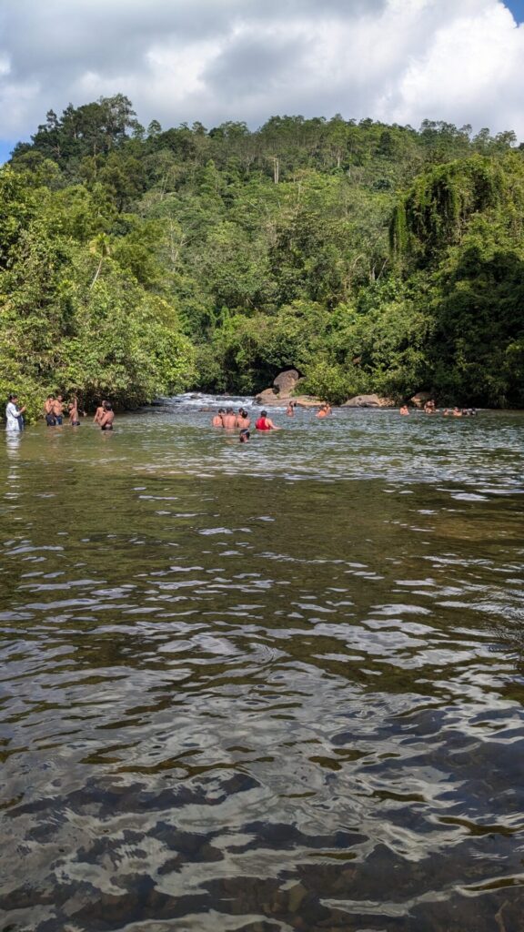 People bathing in river part of bopath ella